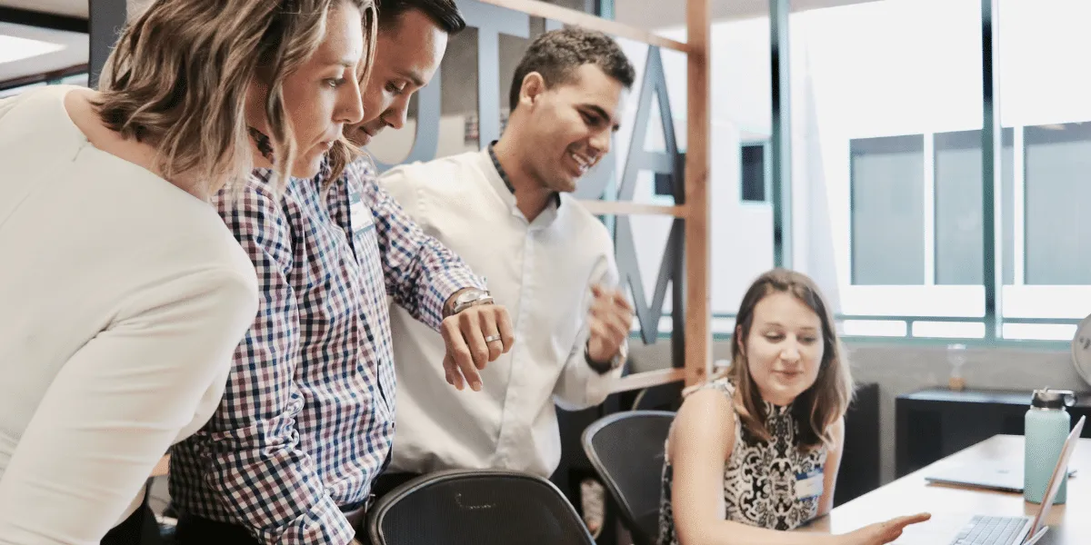 Engaged employees around a desk